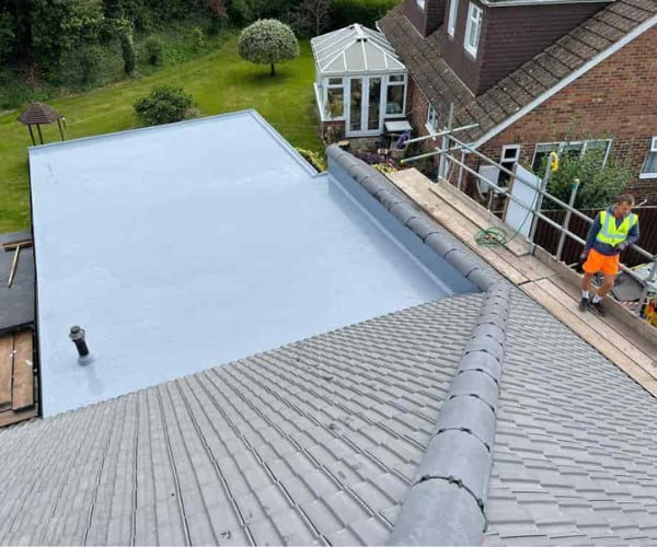 This is a photo of a newly installed hip roof, with a combined liquid covered flat roof. Work carried out by STW Roofing Flitwick