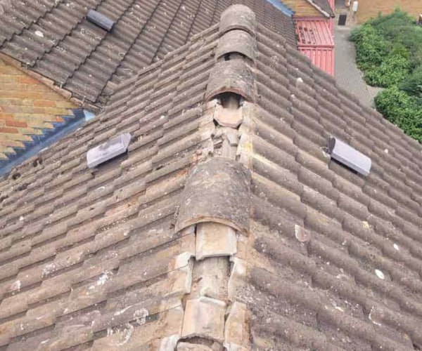 This is a photo if a roof ridge which has missing tiles. The ridge tiles are being replaced by STW Roofing Flitwick